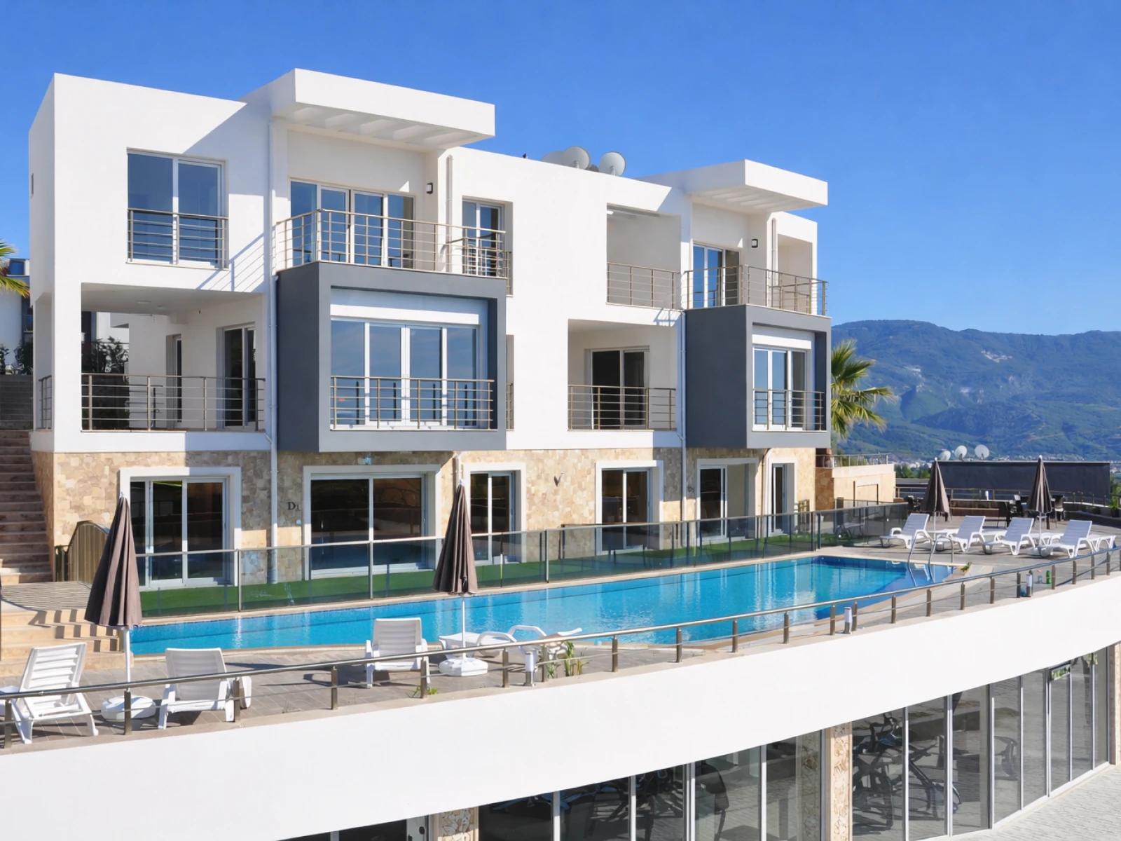 Lavender Residence exterior with shared pool and residence setting in Kuşadası