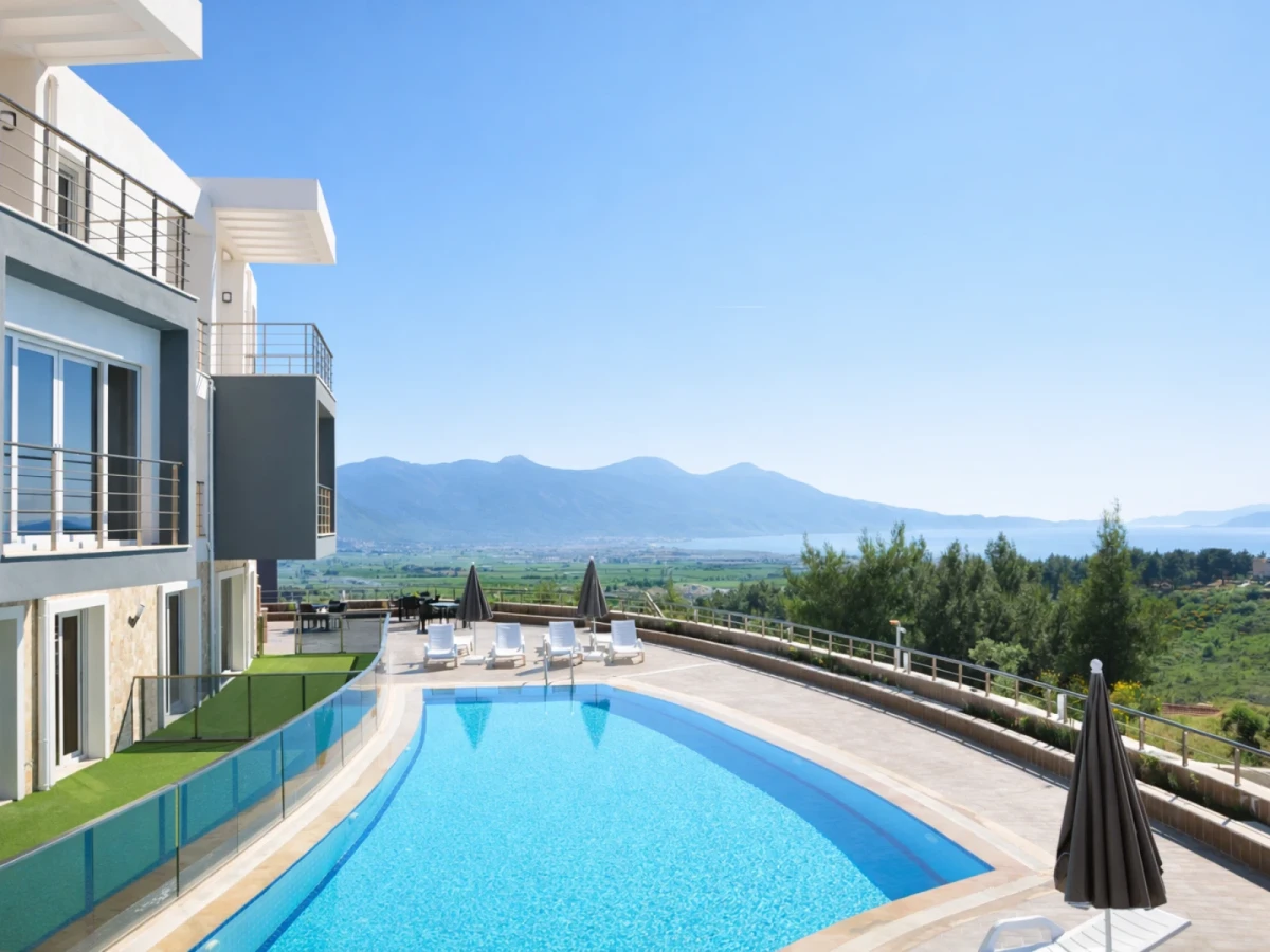 Shared outdoor pool and mountain view at Lavender Residence D1 in Kuşadası