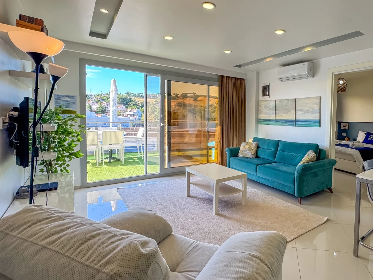 Kuşadası Lavender Residence D1 living room opening onto the poolside terrace