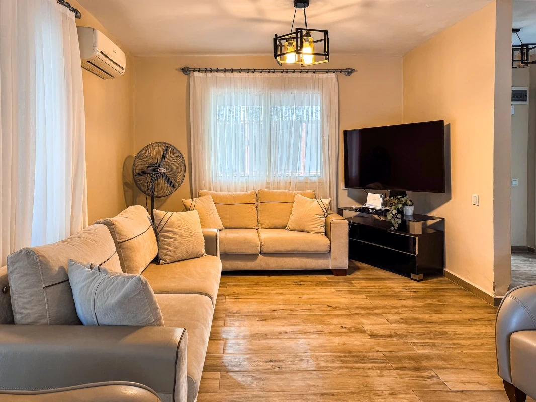 Villa Kumsal living room: spacious seating area with TV