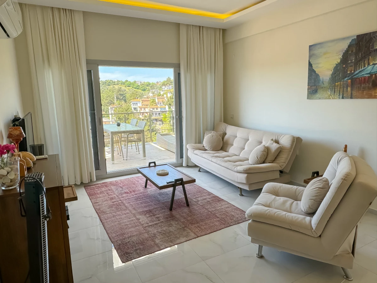 Bright living room and modern seating area in a furnished penthouse apartment