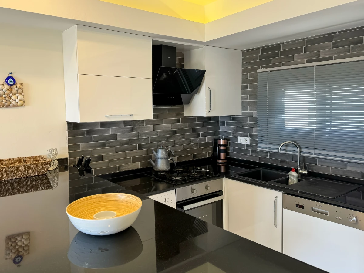 Modern fully equipped kitchen in a ready-to-use apartment for sale