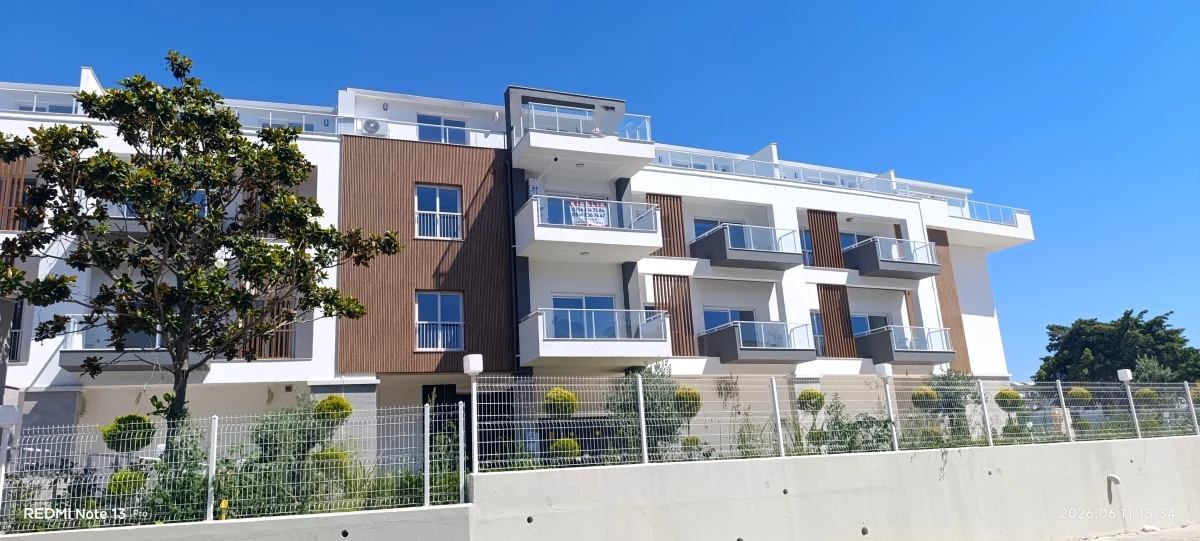 Kuşadası Kadınlar Denizi plajına 100 metre mesafede satılık sıfır çatı dubleks daire dış cephe