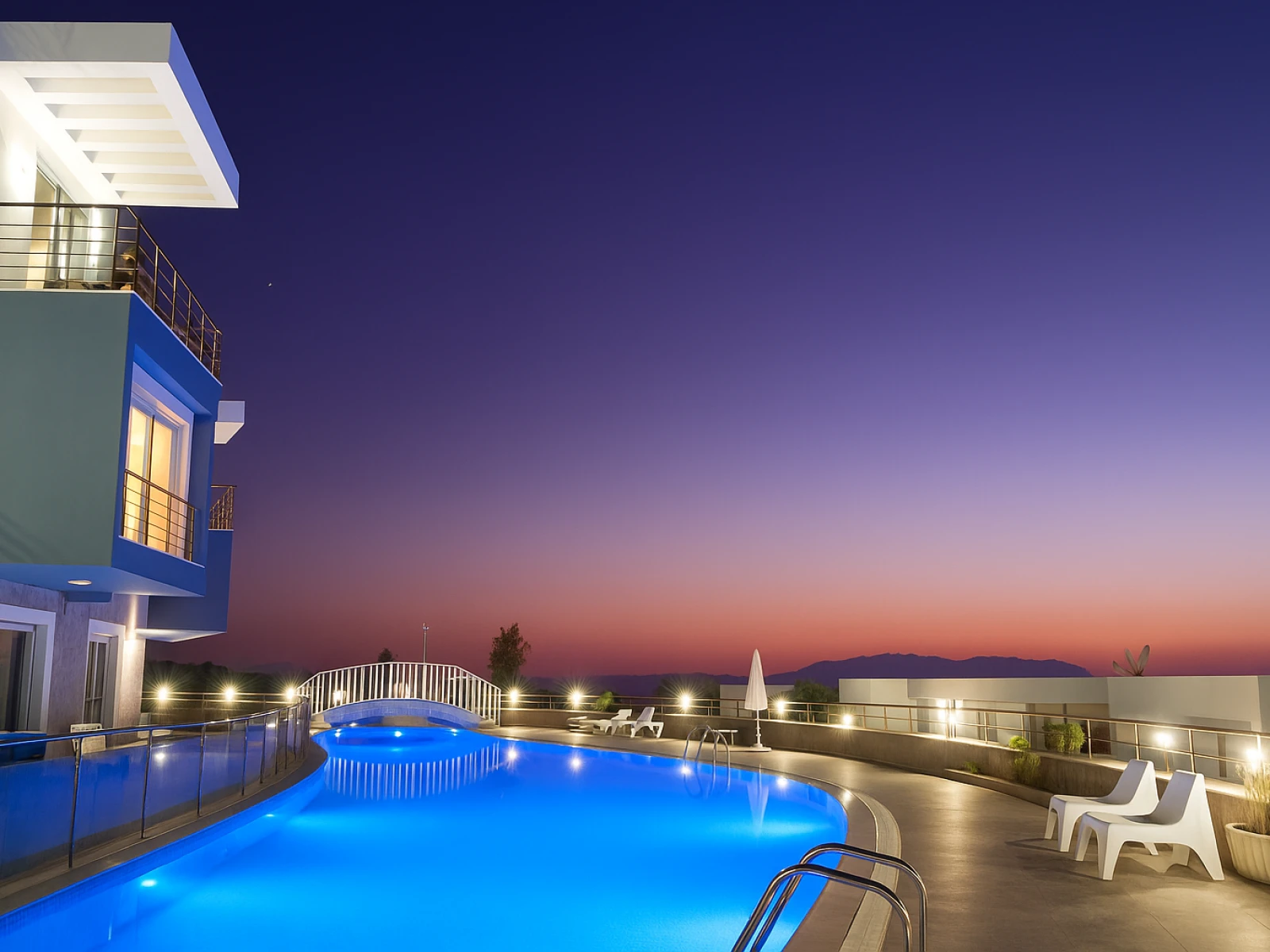 Shared outdoor pool at Lavender Residence in Kuşadası at night