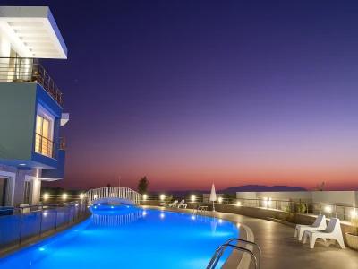 Shared outdoor pool at night at Lavender Residence in Kuşadası
